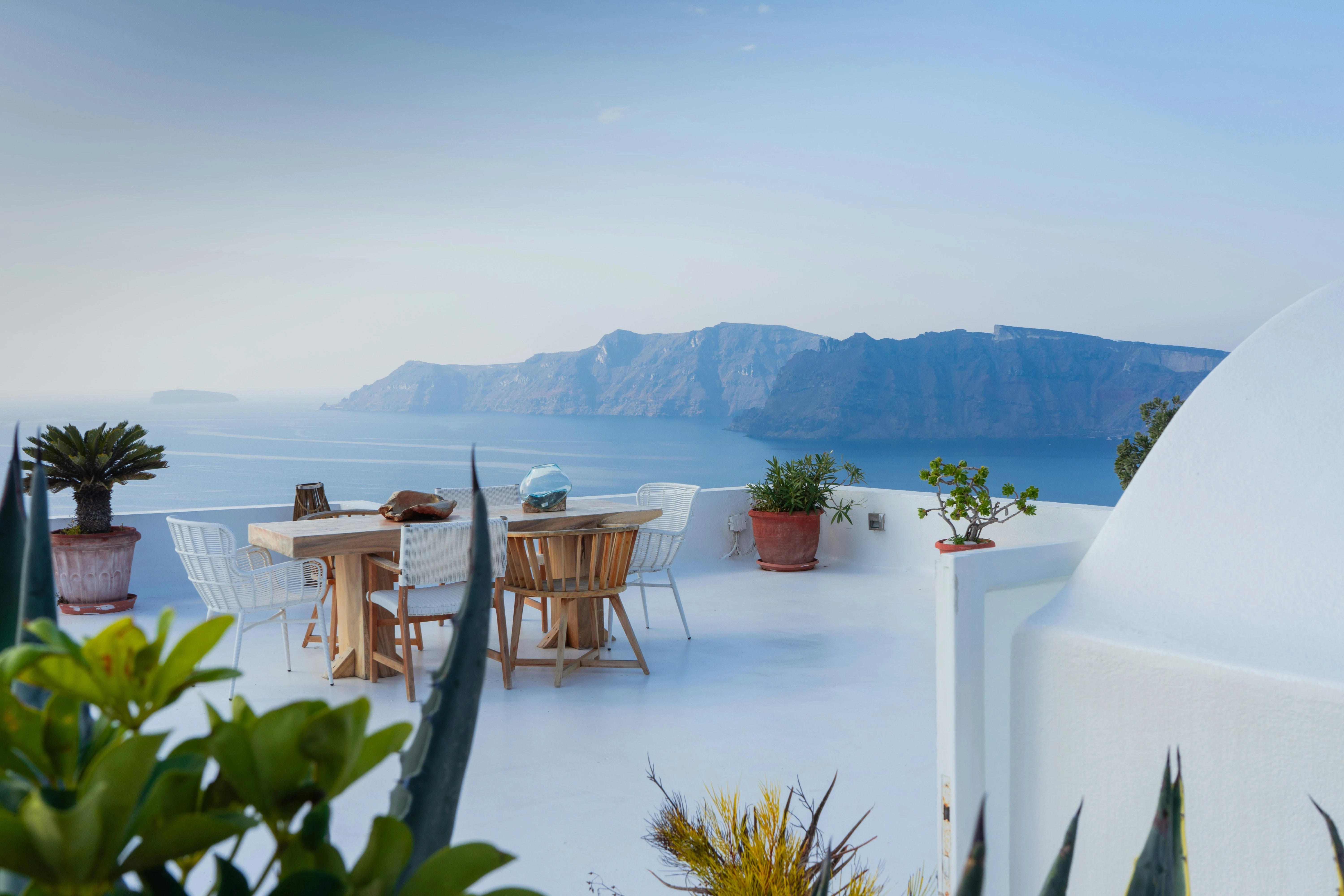 Santorini terrace overlooking the caldera at sunset